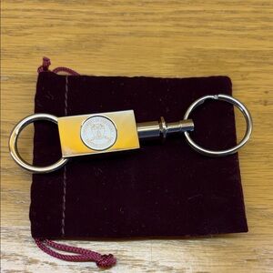 Double-Ring Metal Keychain with UNBC emblem